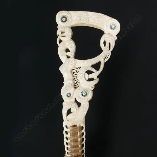An elaborate Maori carved whalebone handled walking stick