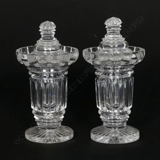 A pair of Regency cut crystal lidded sweetmeat containers