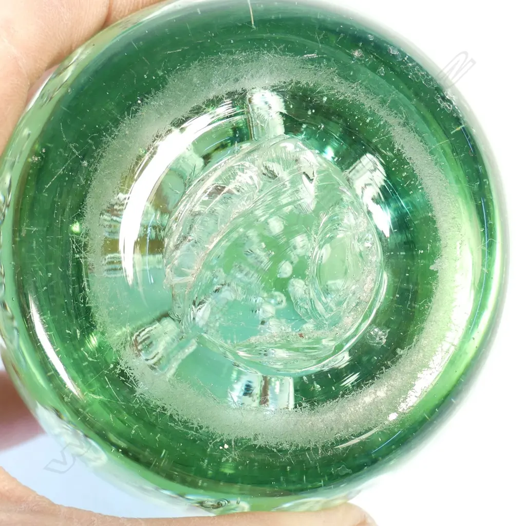 A Victorian green glass 'dump' paperweight Image 1++