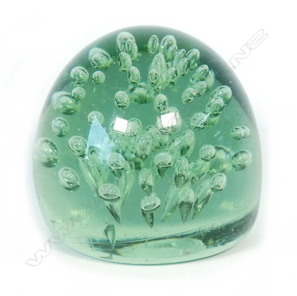 A Victorian green glass 'dump' paperweight Image 1++
