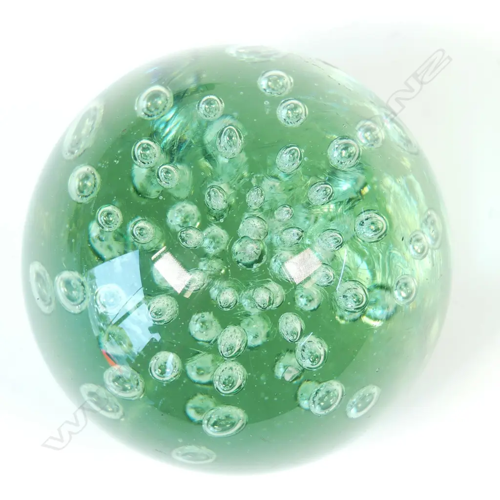 A Victorian green glass 'dump' paperweight Image 1++