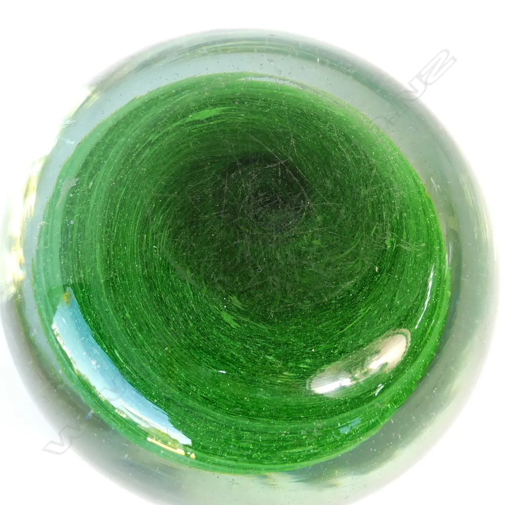 A late 19thC green glass paperweight Image 1++
