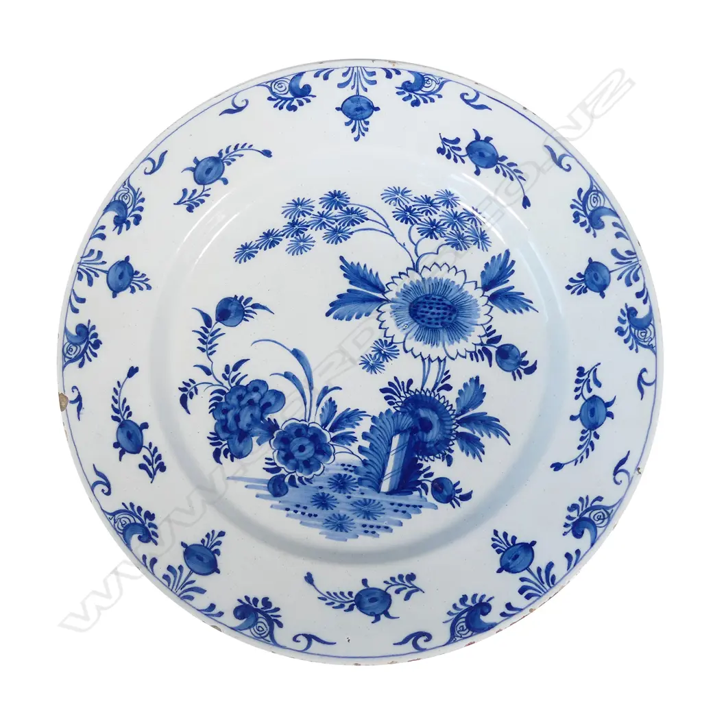 A large Delft blue and white tin glazed charger Image 1++
