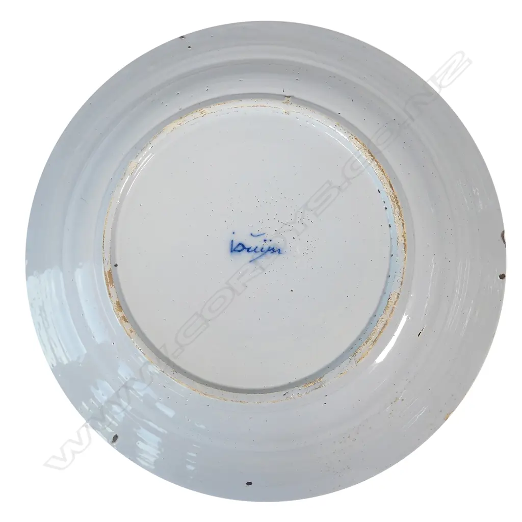 A large Delft blue and white tin glazed charger Image 1++