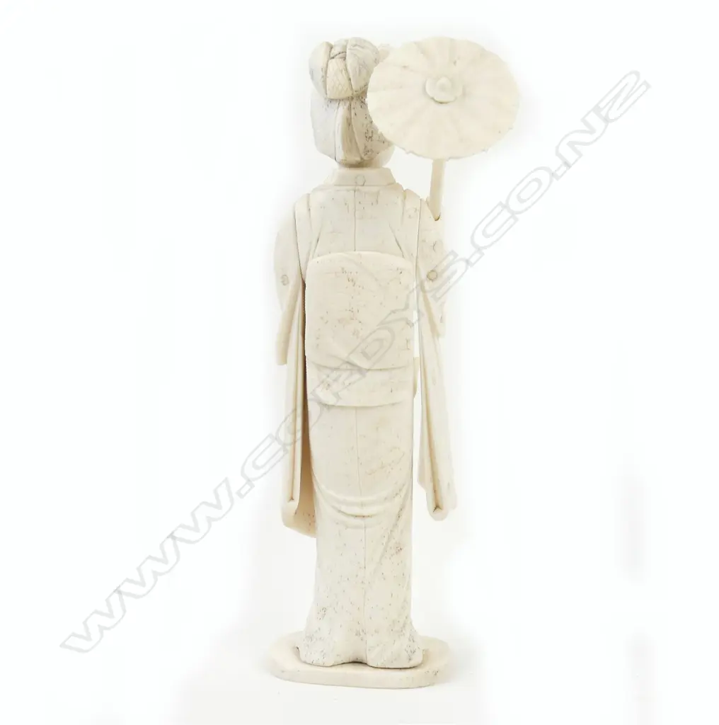 A Japanese bone sectional figure of a woman with parasol and fan Image 1++
