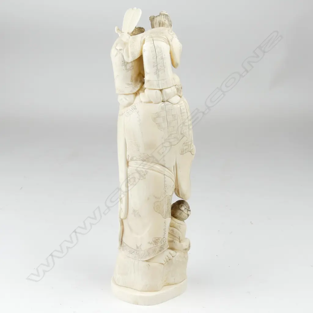 A tall old marine ivory carving of Hotei Image 1++