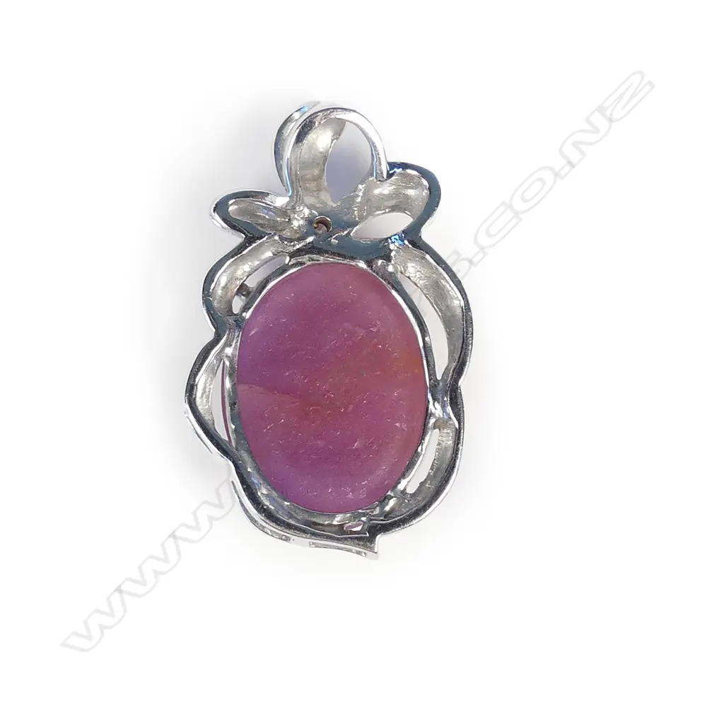 An 18ct white gold ruby and diamond pendant Image 1++