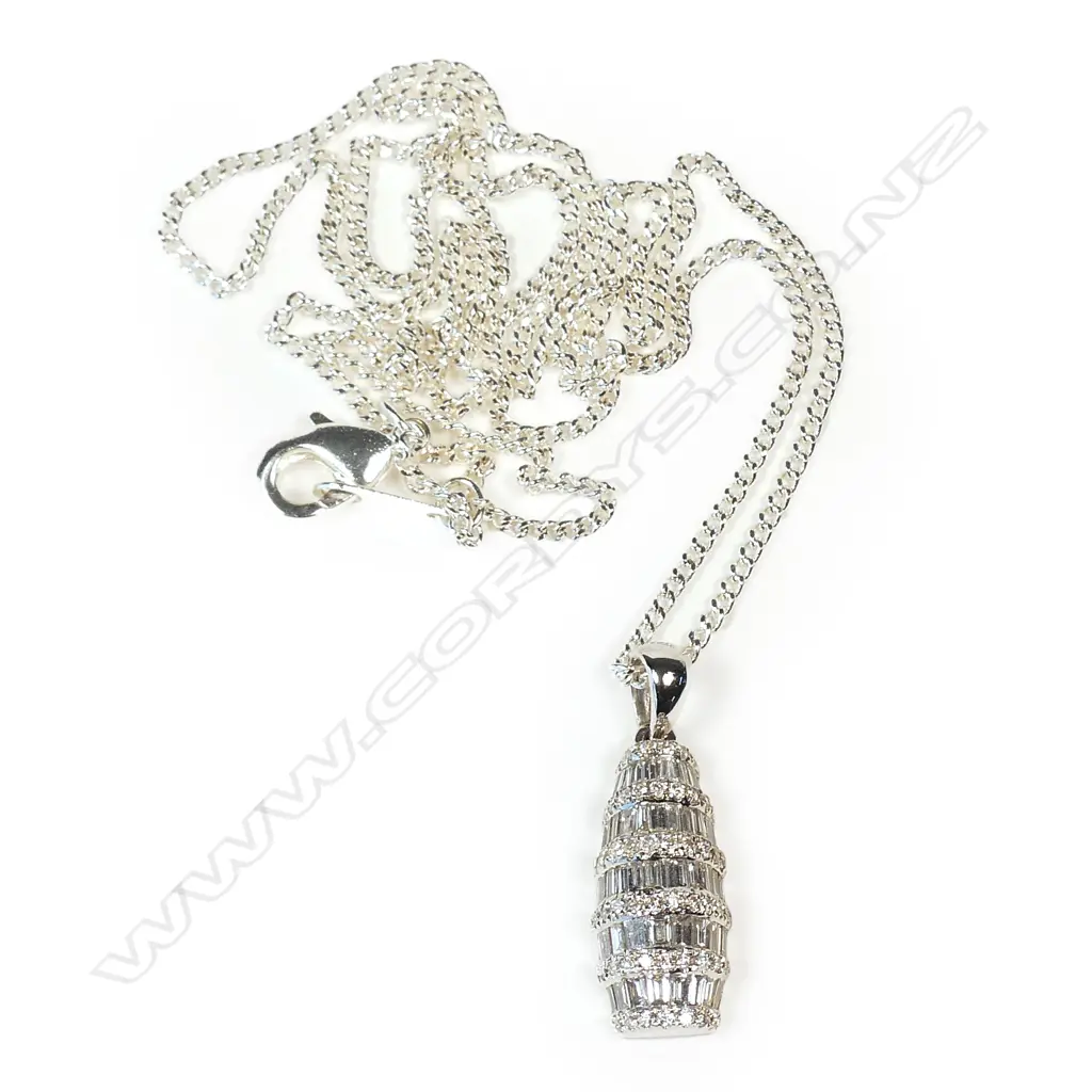 A modern 18ct. white gold diamond set pendant on chain Image 1++