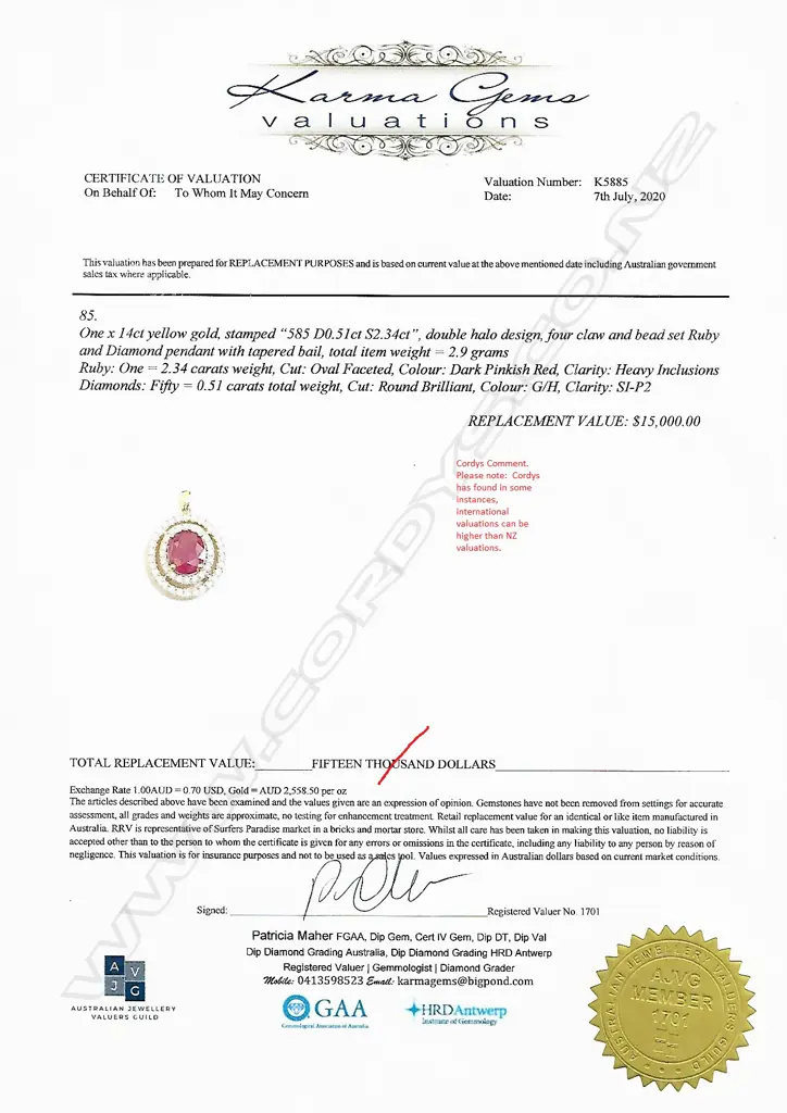 A 14ct gold ruby and diamond double halo pendant Image 1++