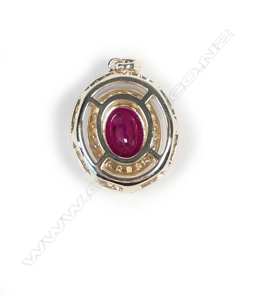 A 14ct gold ruby and diamond double halo pendant Image 1++