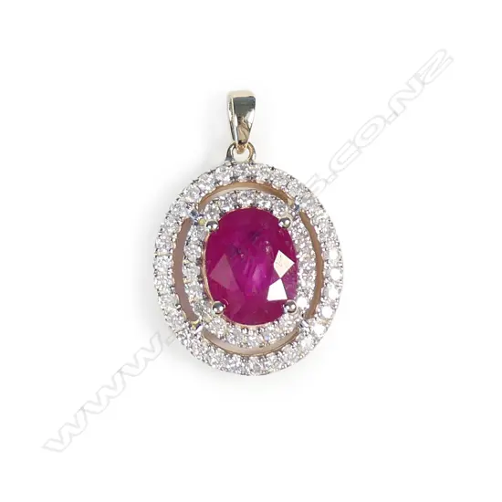 A 14ct gold ruby and diamond double halo pendant