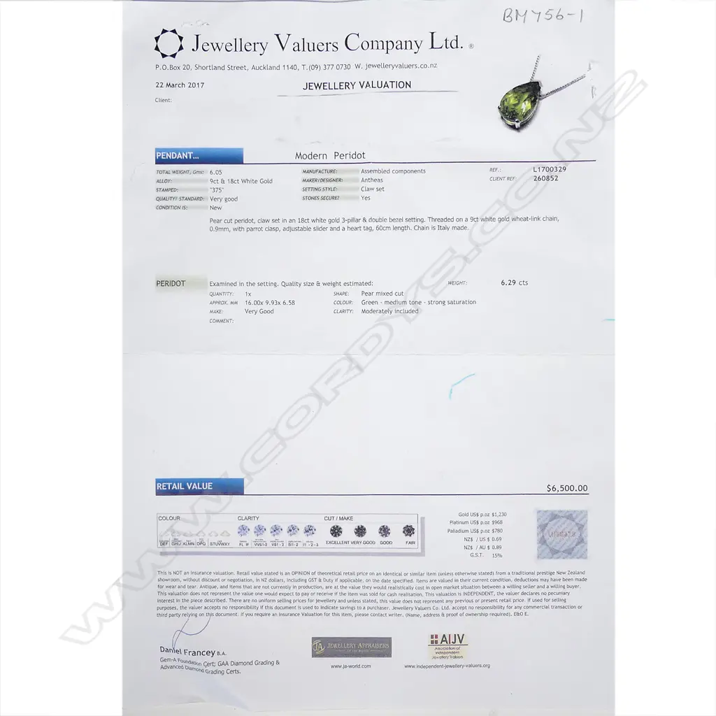 An 18ct white gold and peridot pendant Image 1++