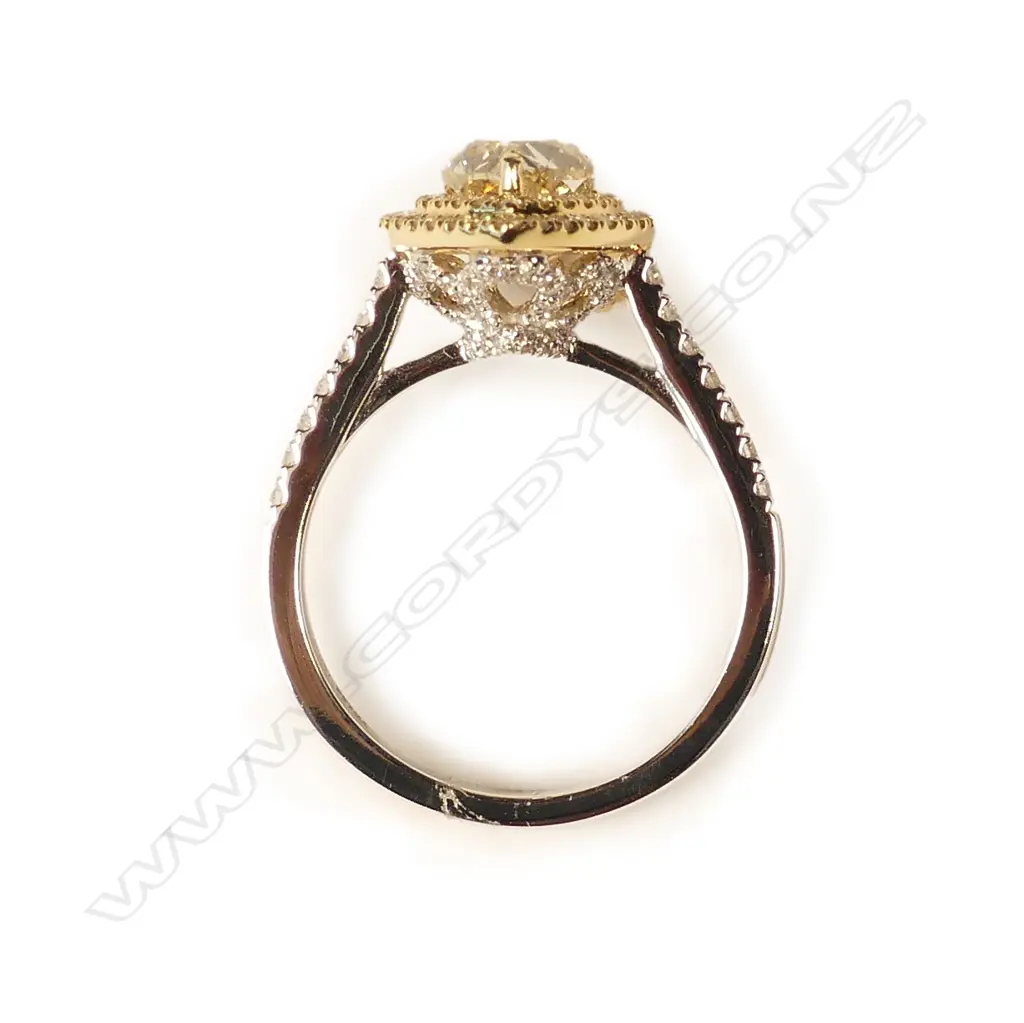 An 18ct. modern white gold multi-stone diamond set ring Image 1++