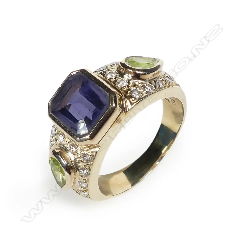 A 18ct and 9ct gold diamond amethyst and peridot dress ring Image 1++