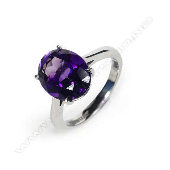 An 18ct white gold and amethyst dress ring