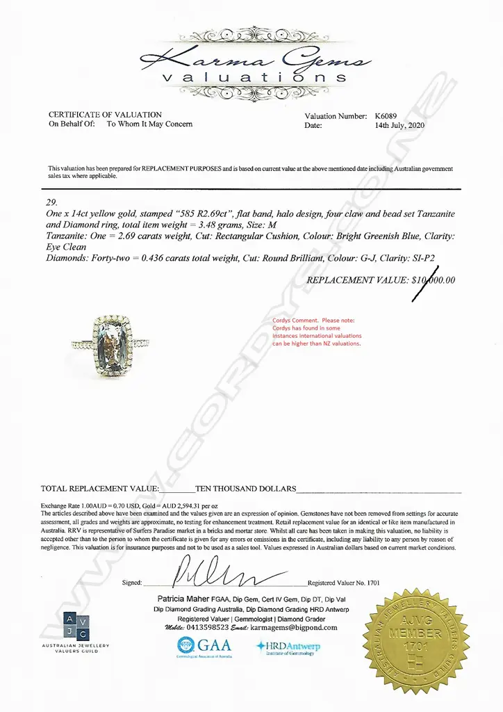 A 14ct gold tanzanite and diamond halo ring Image 1++