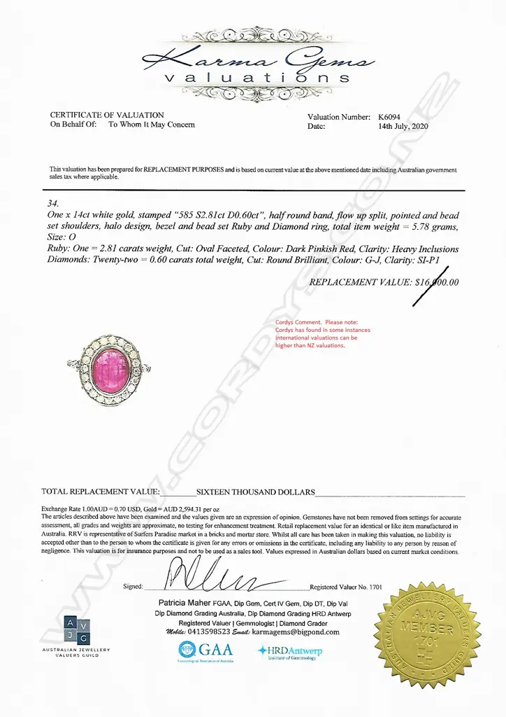 A 14ct white gold ruby and diamond halo ring Image 1++