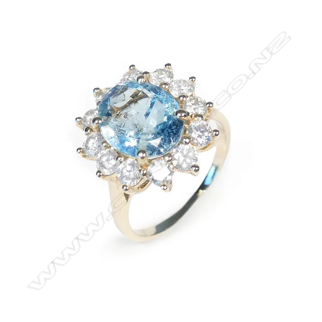 A 14ct gold aquamarine and diamond ring Image 1++