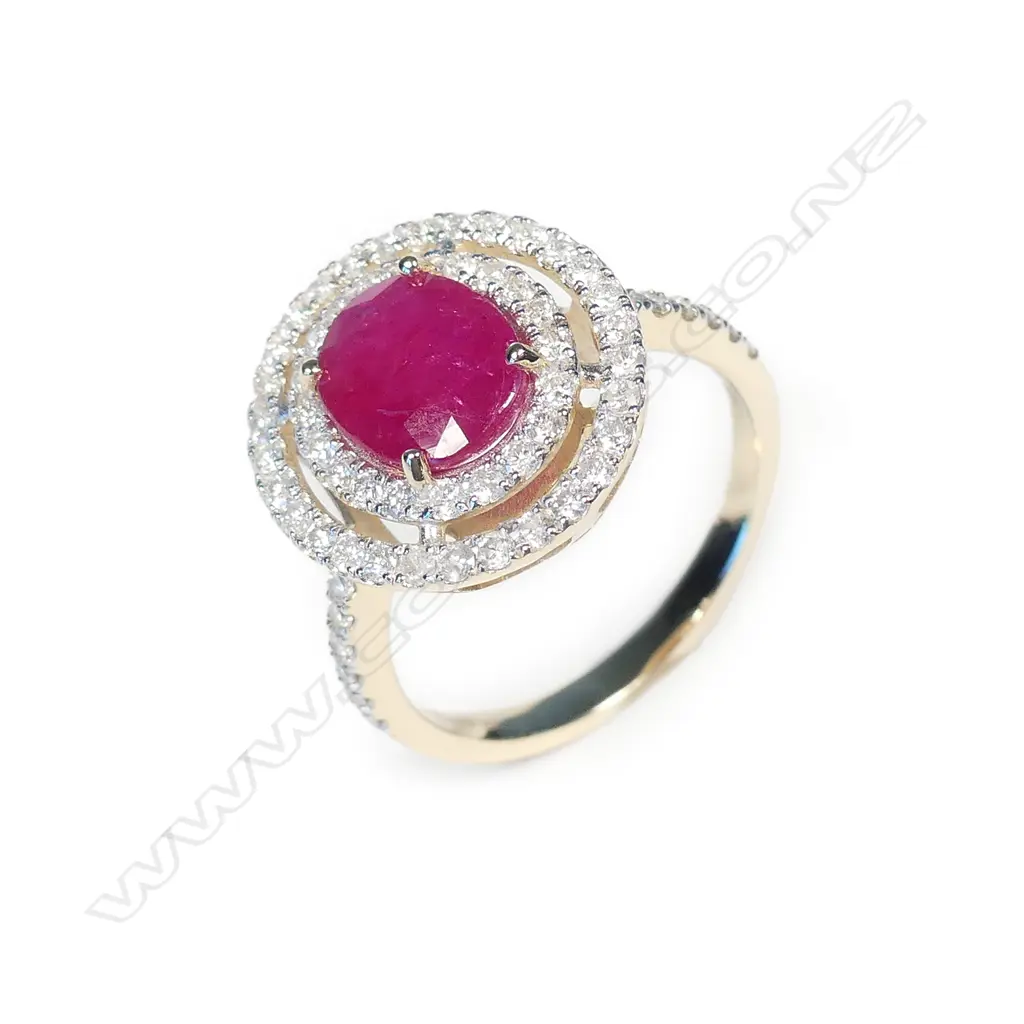 A 14ct white gold ruby and diamond halo ring Image 1++