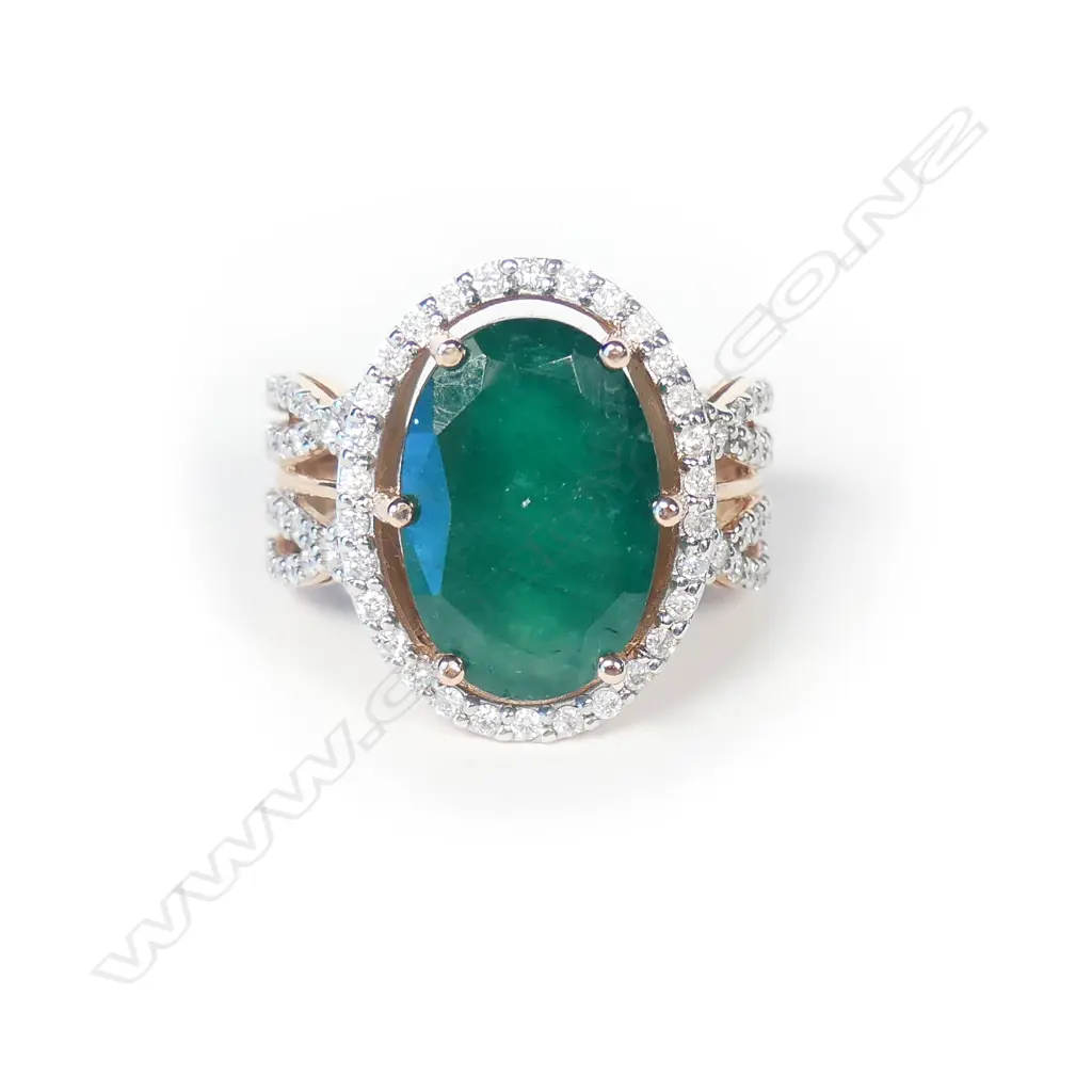 A 14ct rose gold emerald and diamond ring Image 1++