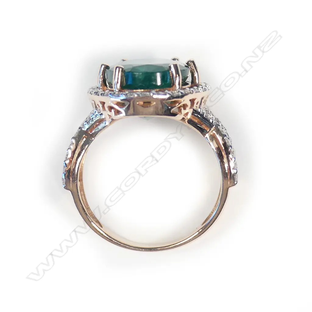 A 14ct rose gold emerald and diamond ring Image 1++