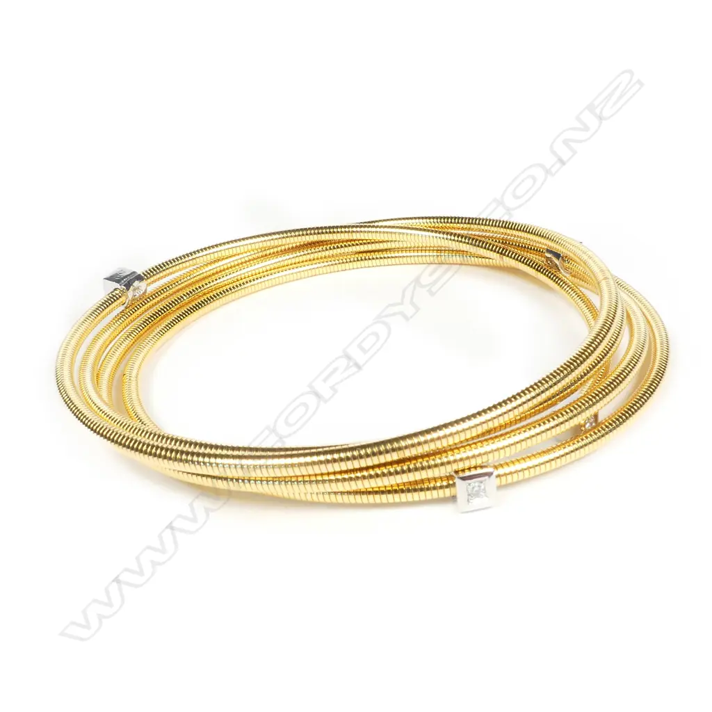 A modern 18ct. diamond set multi-loop bangle Image 1++