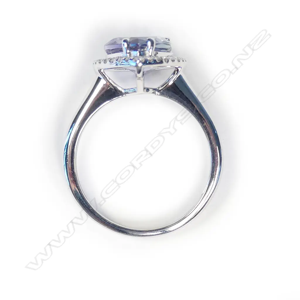 A 14ct white gold tanzanite and diamond halo ring Image 1++