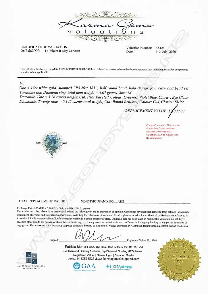 A 14ct white gold tanzanite and diamond halo ring Image 1++