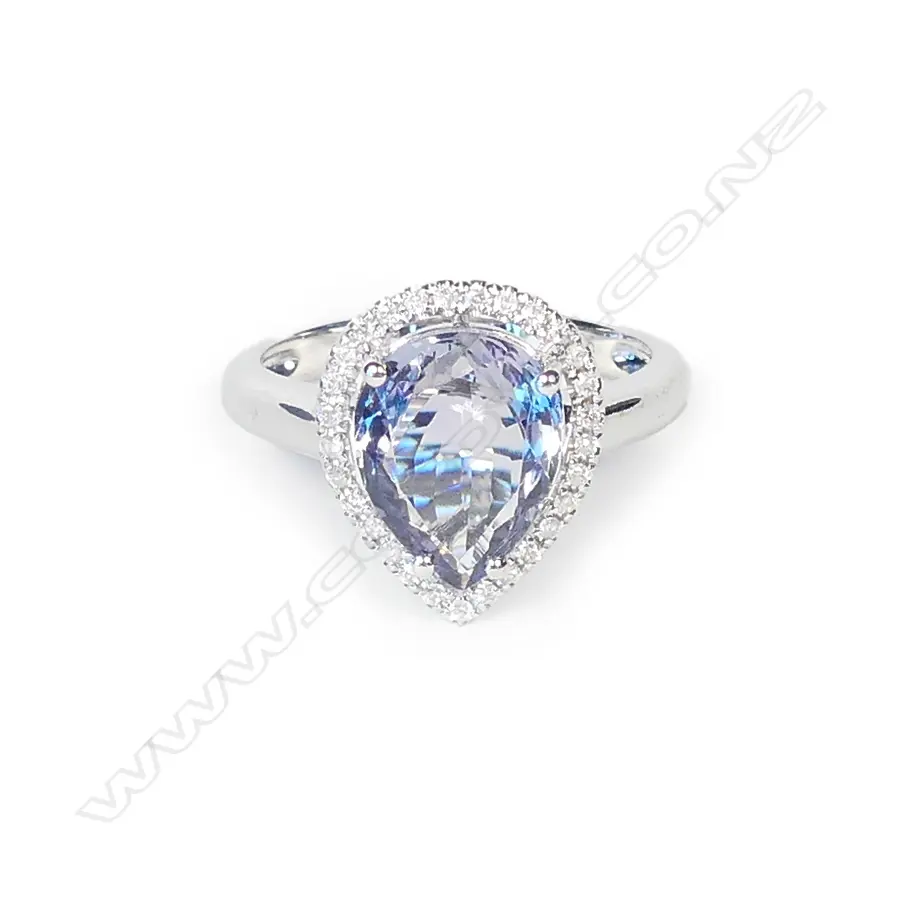 A 14ct white gold tanzanite and diamond halo ring Image 1++