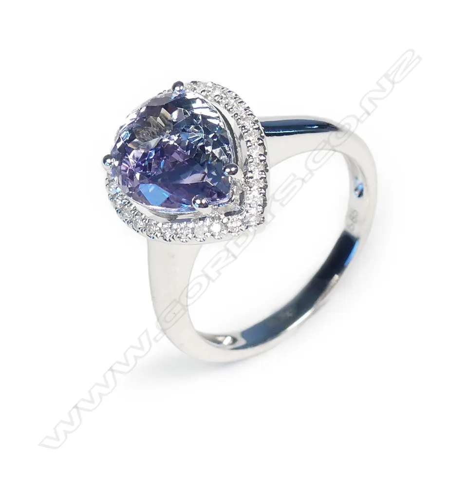 A 14ct white gold tanzanite and diamond halo ring Image 1++