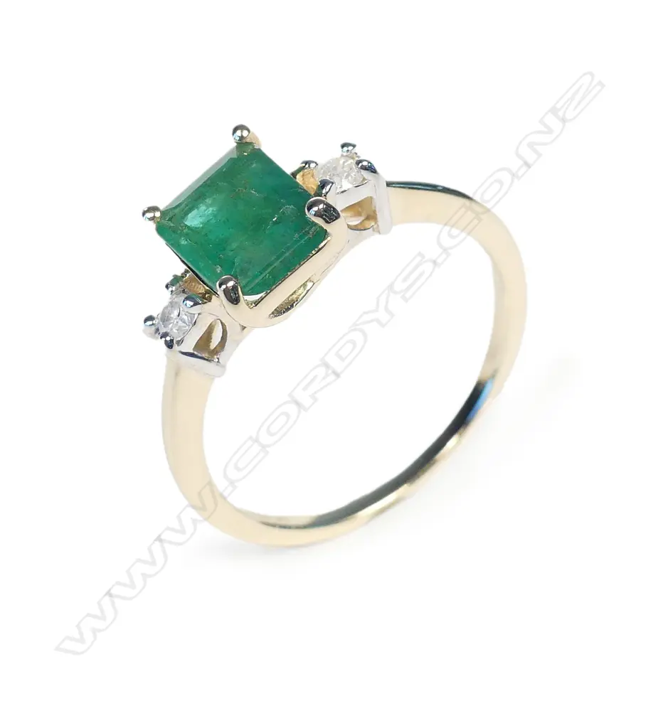 A 14ct gold emerald and diamond ring Image 1++