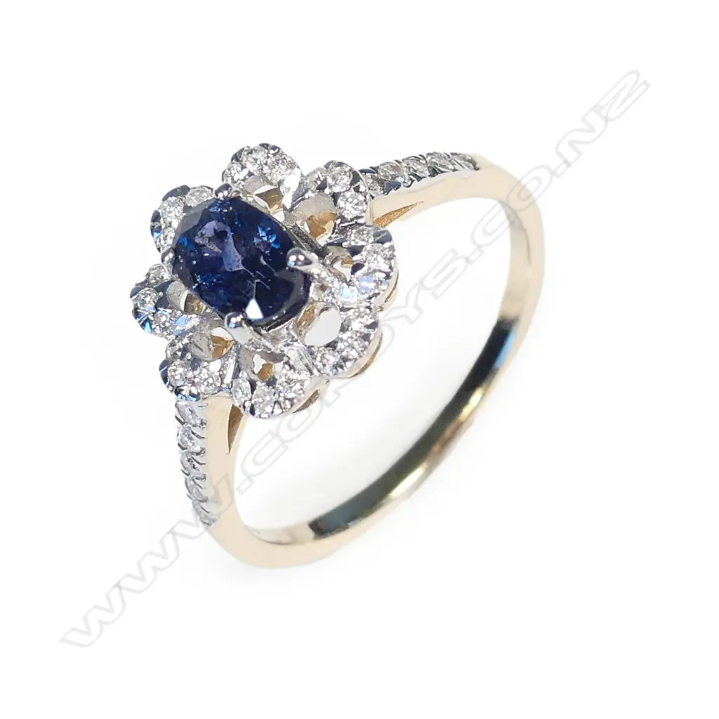 A 14ct gold sapphire and diamond ring Image 1++