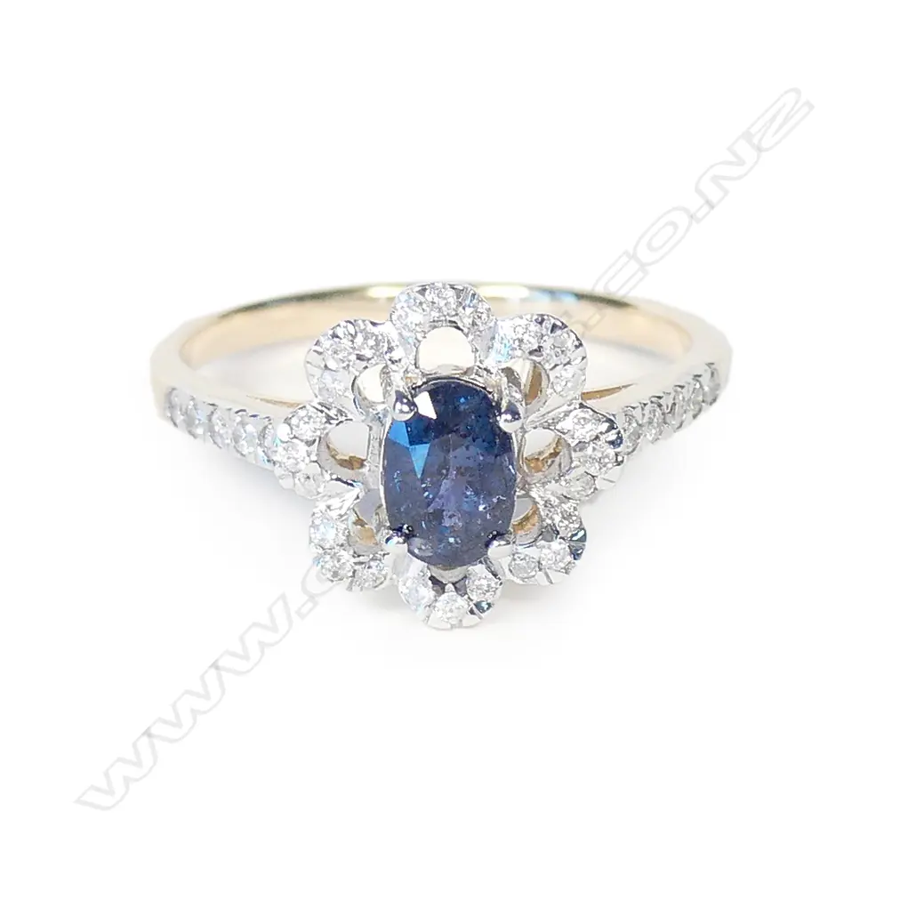 A 14ct gold sapphire and diamond ring Image 1++