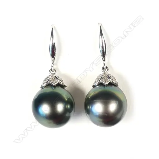 A pair of 18ct white gold and black pearl earrings