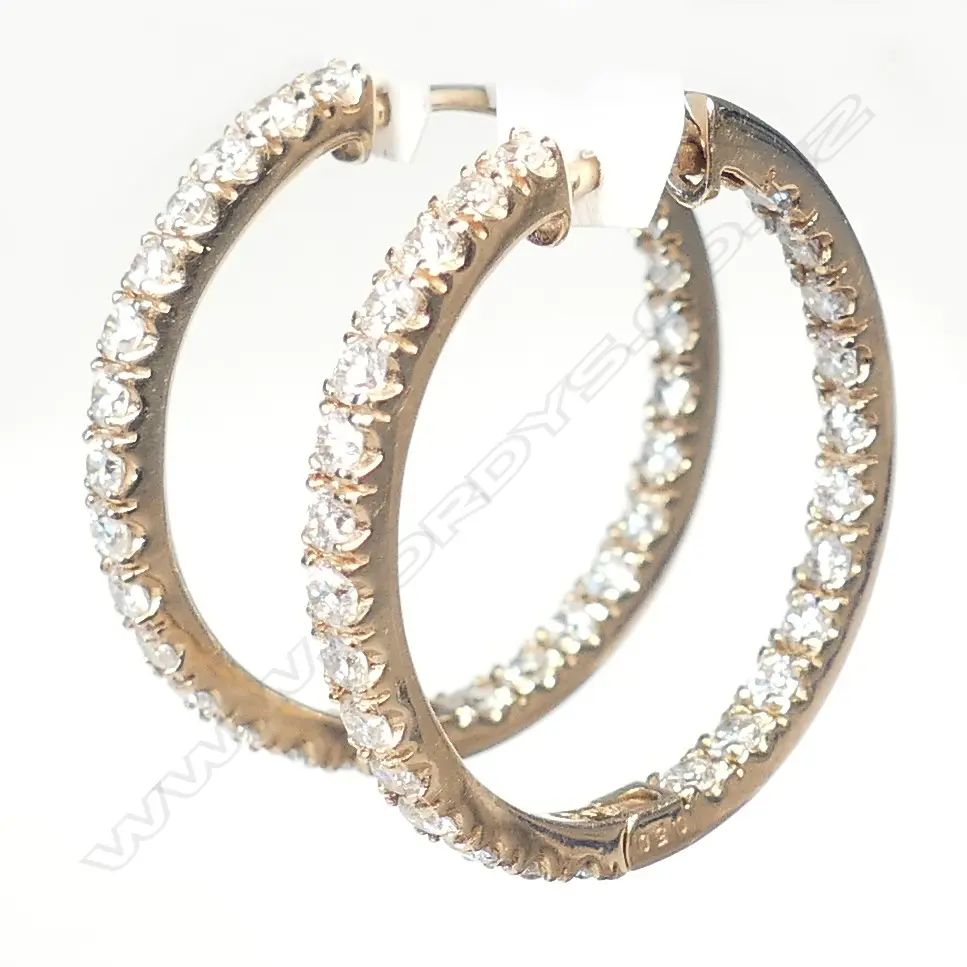 A pair of 18ct rose gold diamond hoop earrings Image 1++