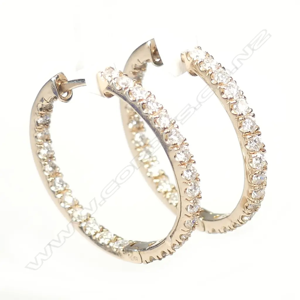 A pair of 18ct rose gold diamond hoop earrings Image 1++