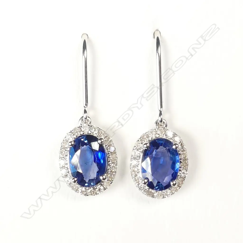 A pair of 14ct white gold sapphire and diamond earrings Image 1++