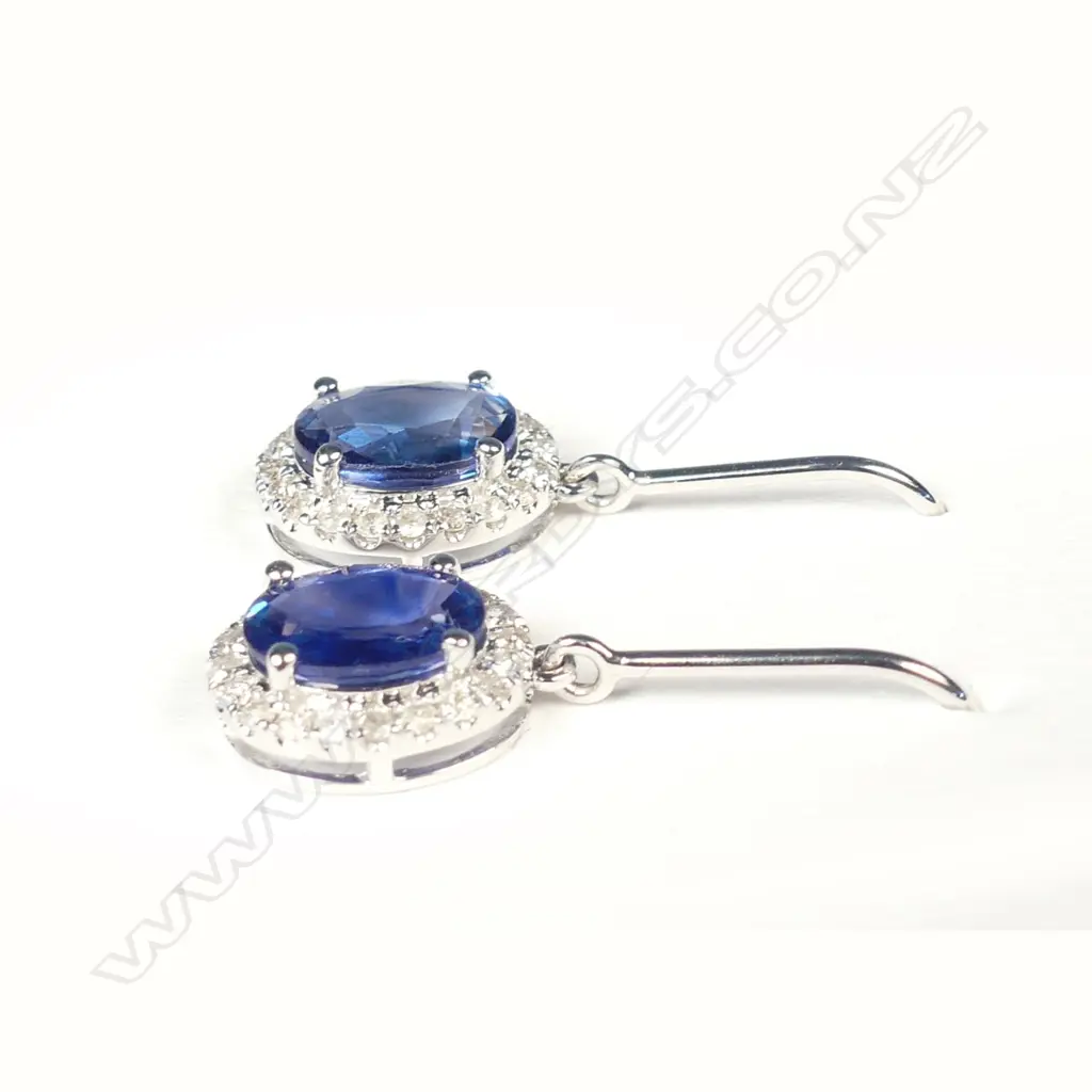 A pair of 14ct white gold sapphire and diamond earrings Image 1++