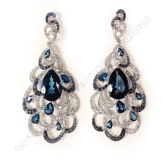 A pair of modern 18ct. white gold blue topaz sapphire and diamond large 'peacock feather' earrings
