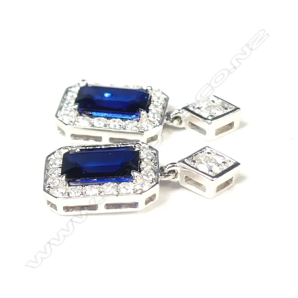 A pair of 14ct white gold sapphire and diamond drop earrings Image 1++