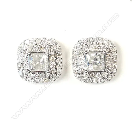 A pair of 14ct white gold and diamond stud earrings