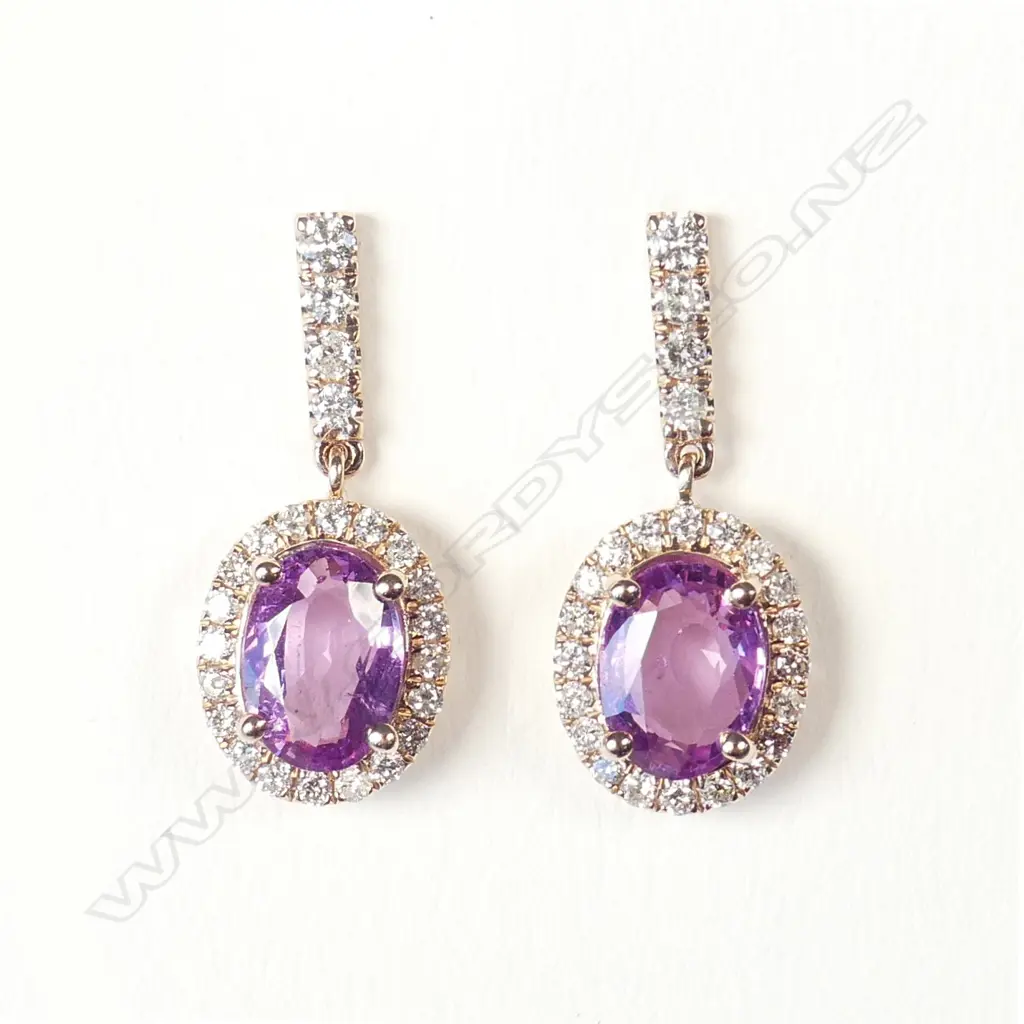 A pair of 14ct rose gold pink sapphire and diamond halo earrings Image 1++