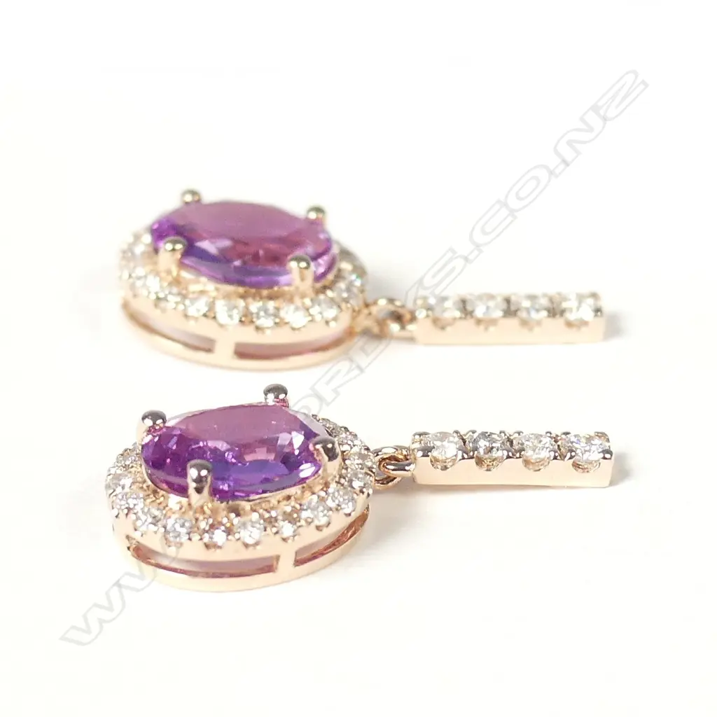 A pair of 14ct rose gold pink sapphire and diamond halo earrings Image 1++