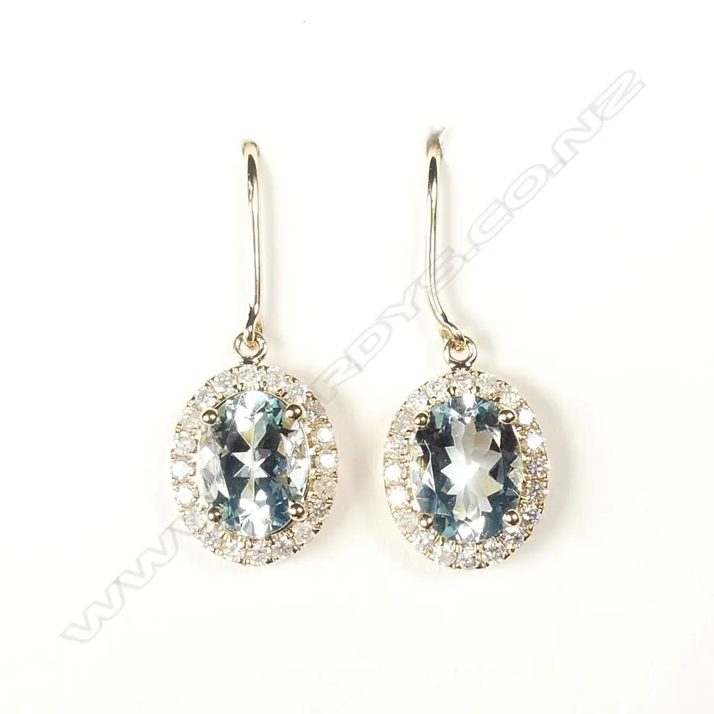 A pair of 14ct gold aquamarine and diamond earrings Image 1++