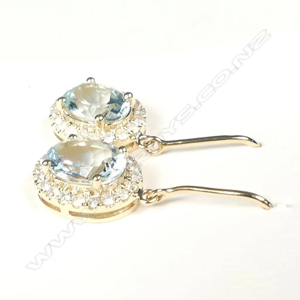 A pair of 14ct gold aquamarine and diamond earrings Image 1++