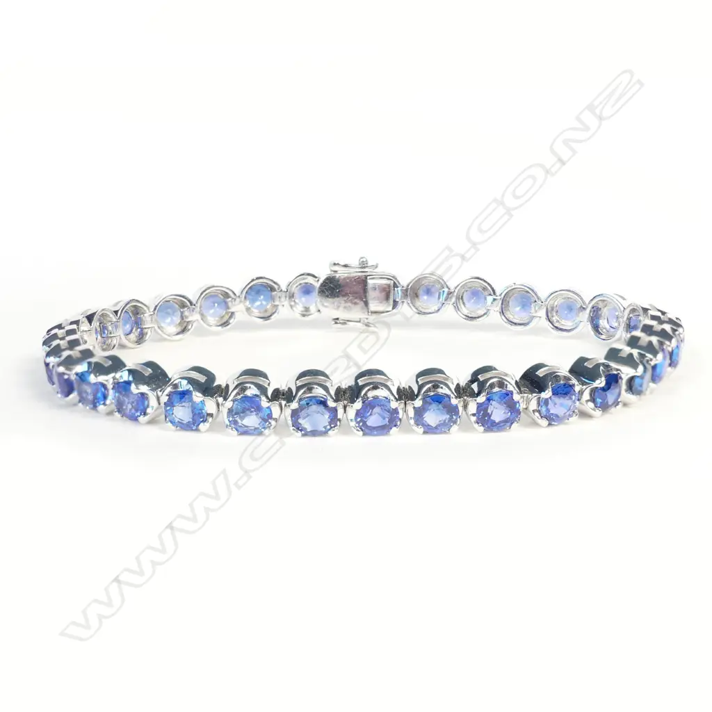 An impressive 18ct white gold and sapphire tennis bracelet Image 1++