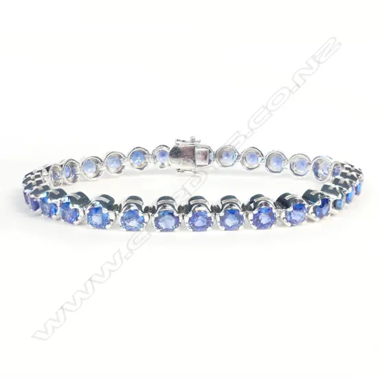 An impressive 18ct white gold and sapphire tennis bracelet