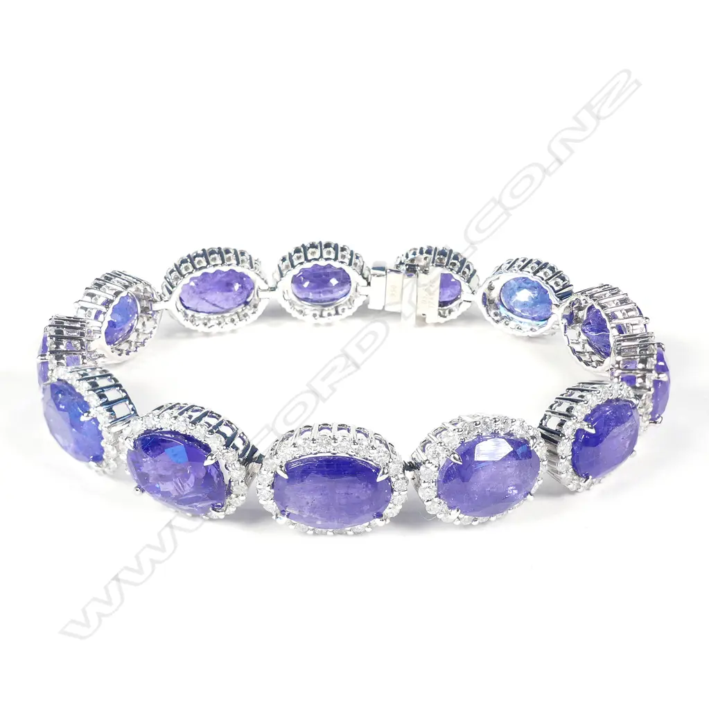 A platinum tanzanite and diamond halo tennis bracelet Image 1++