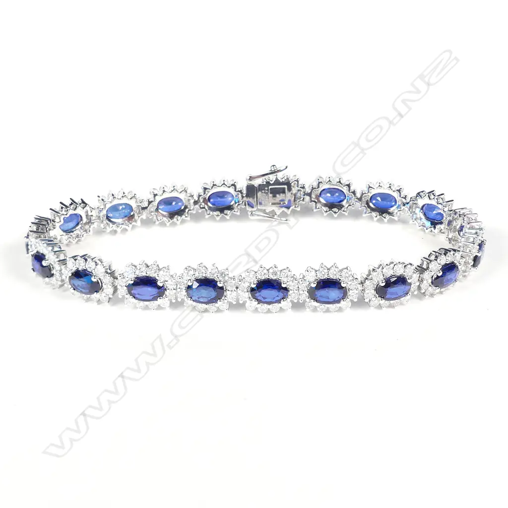 A platinum sapphire and diamond halo tennis bracelet Image 1++