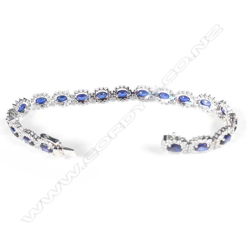 A platinum sapphire and diamond halo tennis bracelet Image 1++